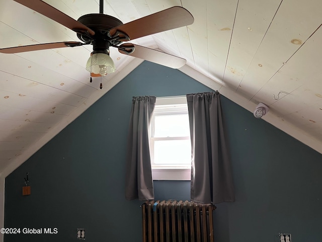 bonus room with lofted ceiling, radiator heating unit, and ceiling fan