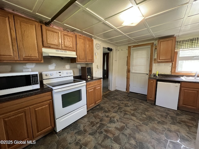 16603 State Route 22, Putnam, NY 12861 - kitchen with white appliances, under cabinet range hood, dark countertops, and a sink