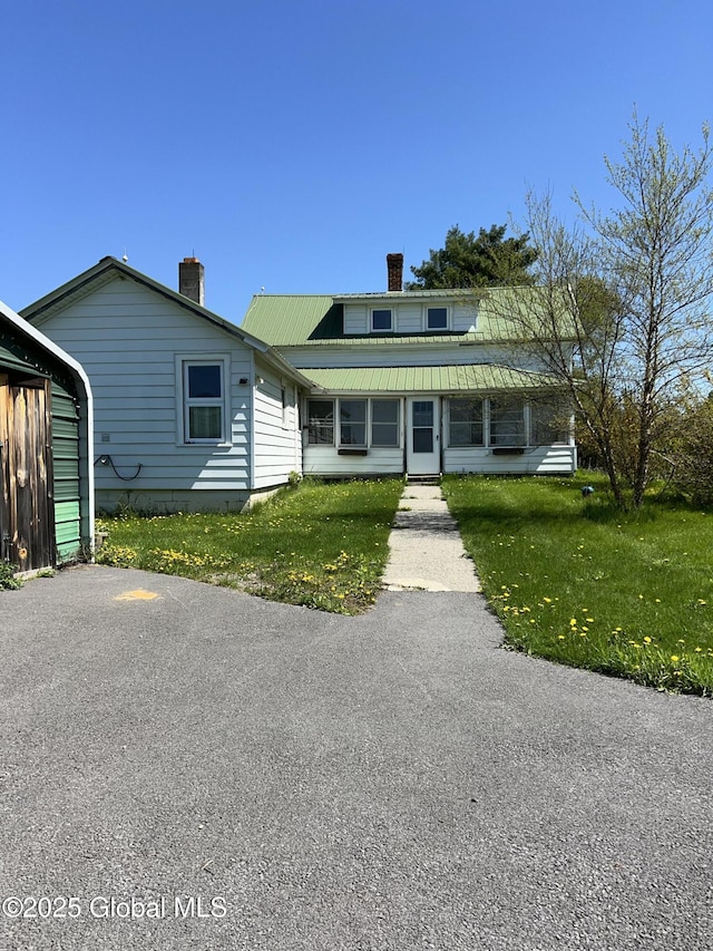 16603 State Route 22, Putnam, NY 12861 - view of front facade featuring a chimney, metal roof, and a front lawn