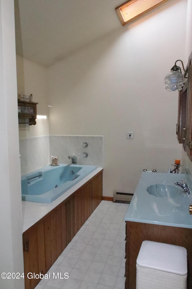 bathroom featuring a tub, a baseboard radiator, vanity, and tile floors