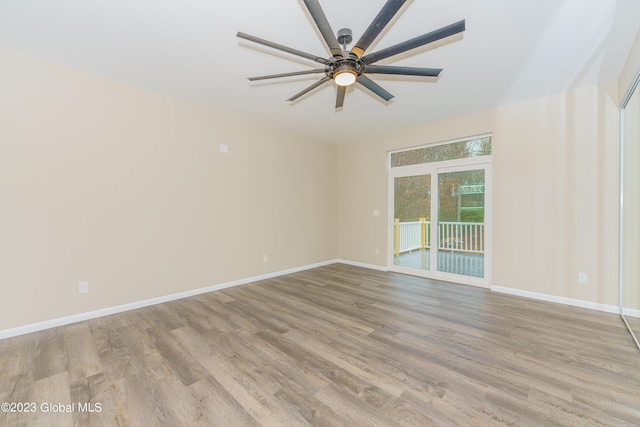 empty room featuring light hardwood / wood-style flooring and ceiling fan