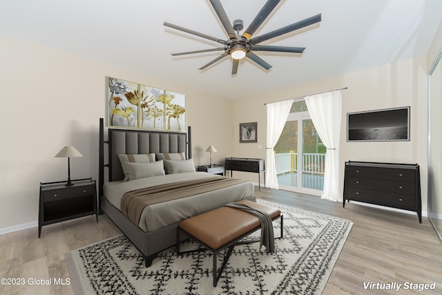 bedroom featuring access to exterior, light hardwood / wood-style flooring, and ceiling fan