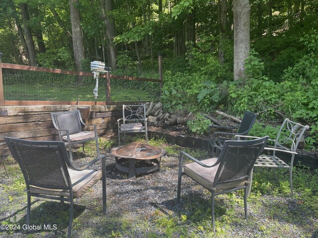 view of yard with a fire pit