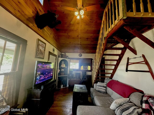 living room with ceiling fan, hardwood / wood-style floors, a wealth of natural light, and wood ceiling