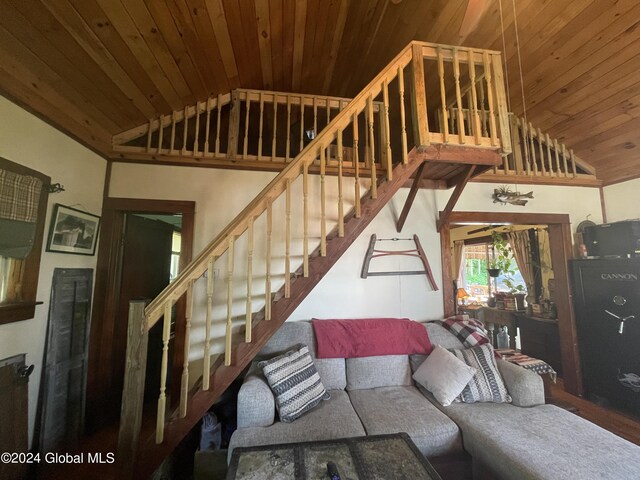 living room with high vaulted ceiling, ceiling fan, and wood ceiling