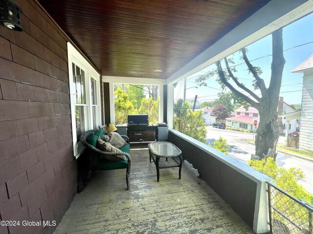 exterior space with wood ceiling