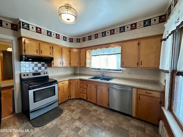 kitchen featuring extractor fan, stainless steel appliances, baseboard heating, dark tile flooring, and sink