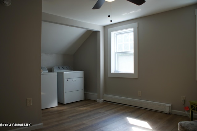 laundry room featuring wood-type flooring, a baseboard radiator, ceiling fan, and washing machine and clothes dryer