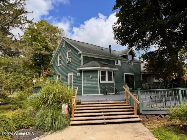 back of house featuring a deck