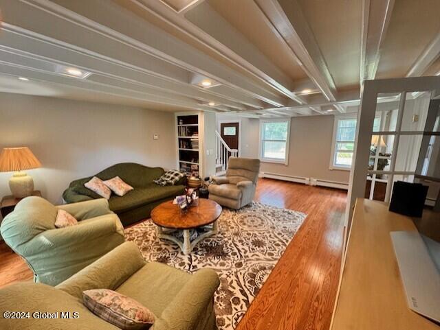 living room with hardwood / wood-style floors and a baseboard radiator