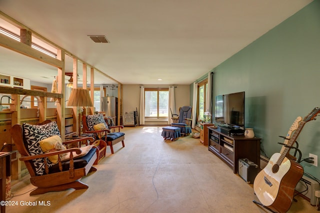 living room featuring concrete flooring