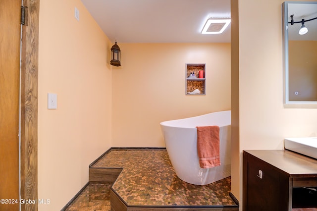 bathroom featuring vanity and tile floors