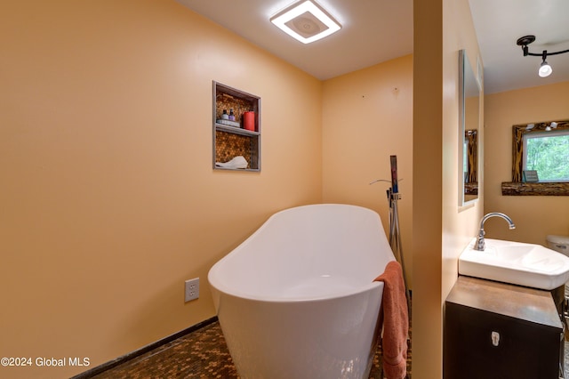 bathroom featuring toilet and oversized vanity