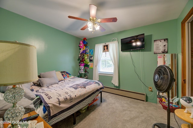 bedroom with baseboard heating, carpet floors, and ceiling fan