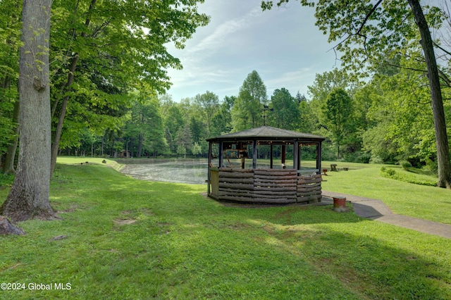 view of property's community with a yard and a gazebo