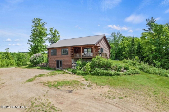 log cabin with a balcony