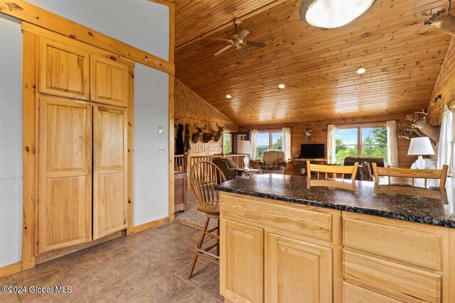 kitchen with ceiling fan, light tile flooring, wood ceiling, and light brown cabinetry