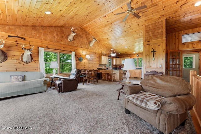 living room with carpet floors, high vaulted ceiling, wood ceiling, and ceiling fan