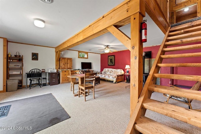 interior space featuring carpet flooring and ceiling fan