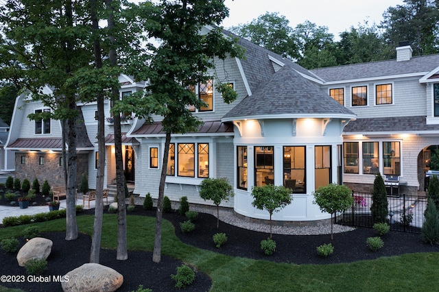 view of front facade featuring a sunroom