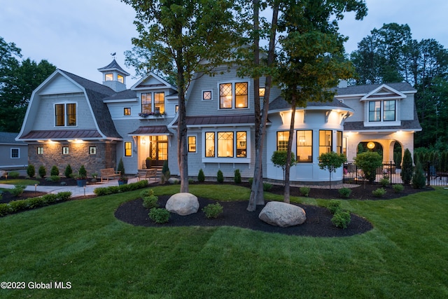 view of front of house with a lawn