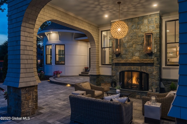 view of patio / terrace featuring an outdoor living space with a fireplace