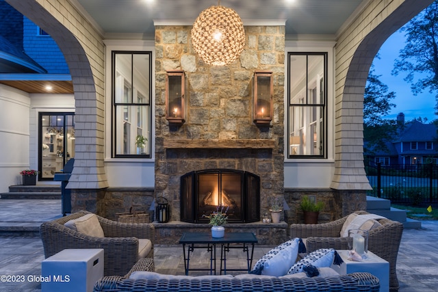 view of patio with an outdoor stone fireplace