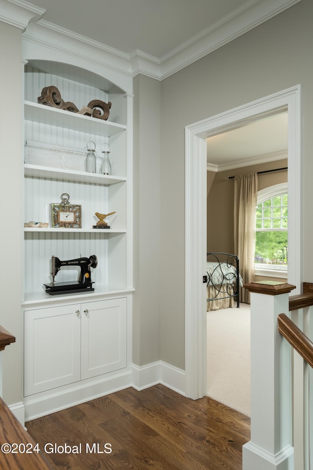 bar with crown molding and dark hardwood / wood-style flooring