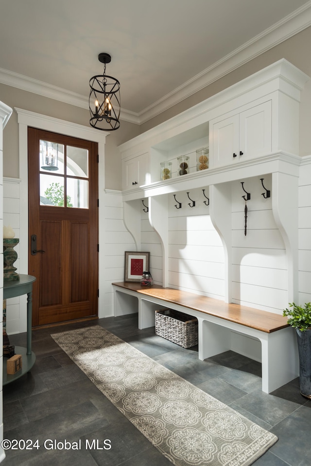 mudroom featuring an inviting chandelier, ornamental molding, and dark hardwood / wood-style flooring