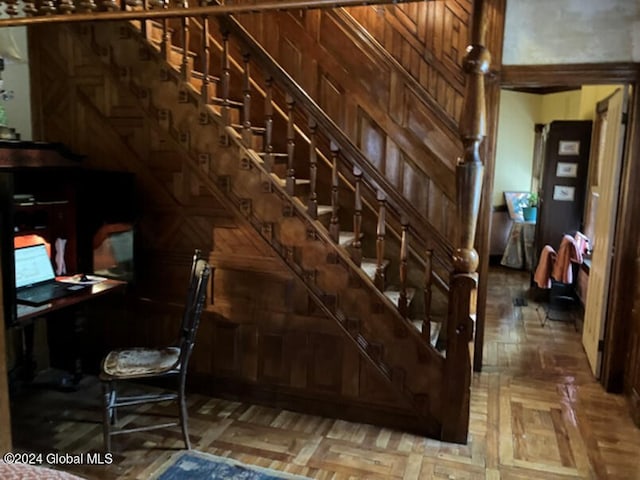 stairway with parquet flooring