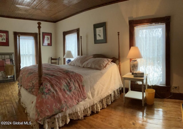 bedroom with hardwood / wood-style floors