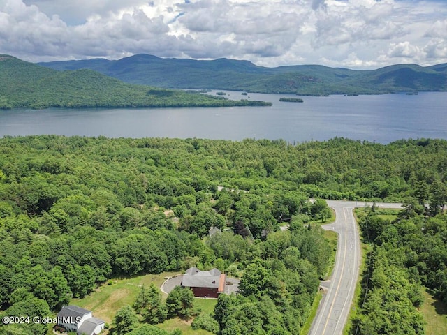 aerial view featuring a water and mountain view