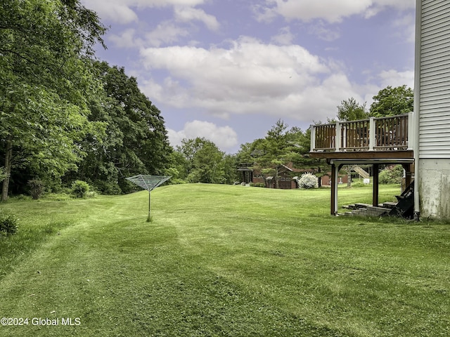 view of yard featuring a wooden deck