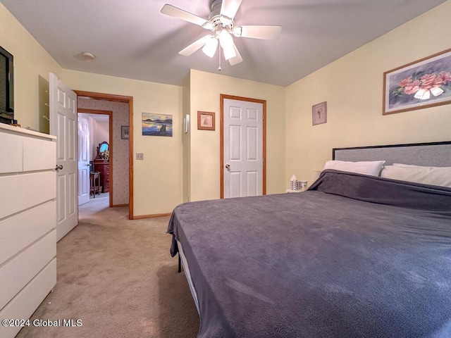 bedroom with light colored carpet and ceiling fan