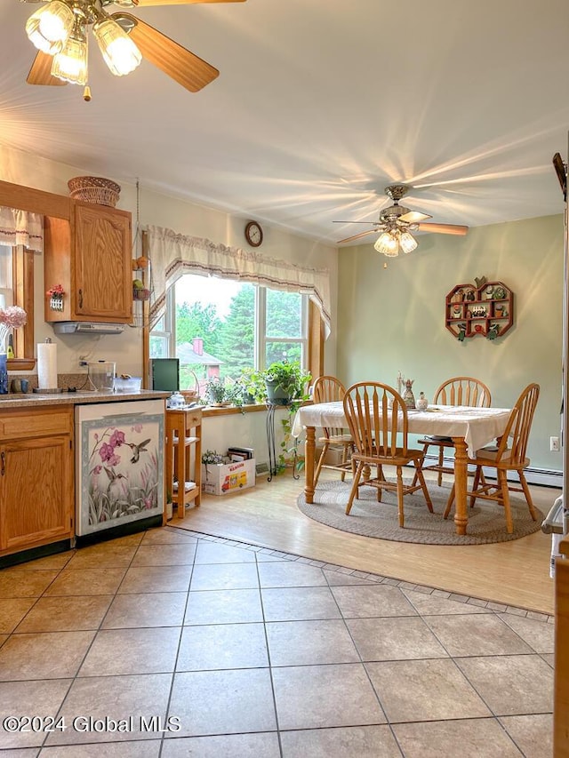 kitchen with stainless steel dishwasher and light tile patterned flooring