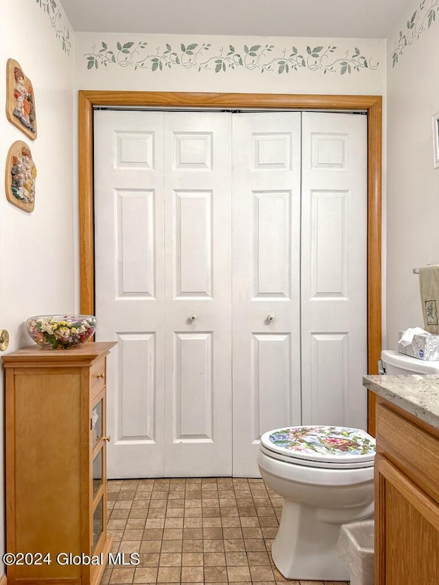 bathroom featuring vanity and toilet