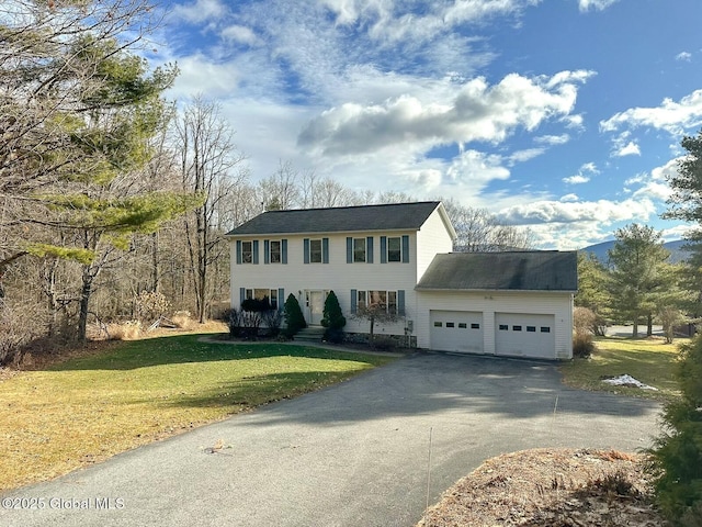 view of front of house featuring a garage and a front yard