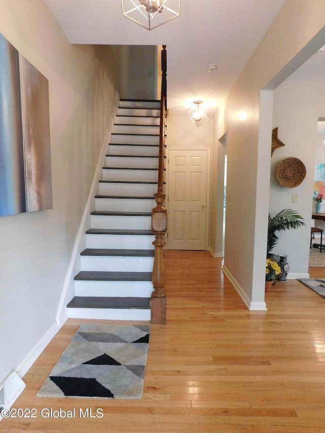 staircase featuring hardwood / wood-style flooring