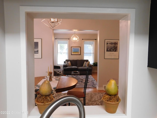 dining area with a chandelier and hardwood / wood-style flooring