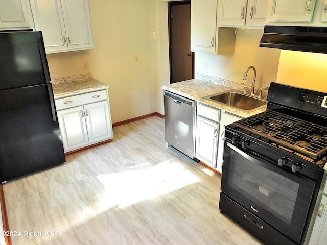 kitchen featuring black appliances, ventilation hood, sink, light wood-type flooring, and white cabinetry