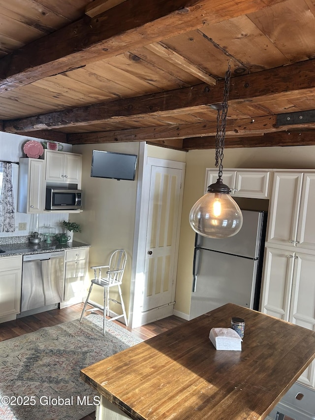 interior space with appliances with stainless steel finishes, white cabinets, wood ceiling, and decorative light fixtures