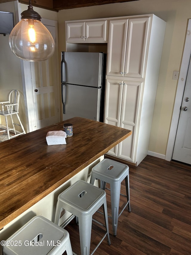 dining area featuring dark hardwood / wood-style flooring