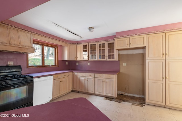 kitchen featuring dishwasher, black gas stove, and light brown cabinetry