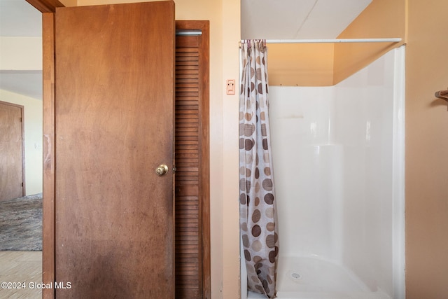 bathroom with a shower with curtain