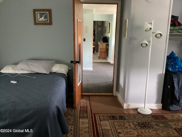 bedroom featuring dark colored carpet