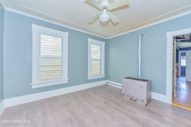 unfurnished room with light hardwood / wood-style flooring, ceiling fan, and ornamental molding