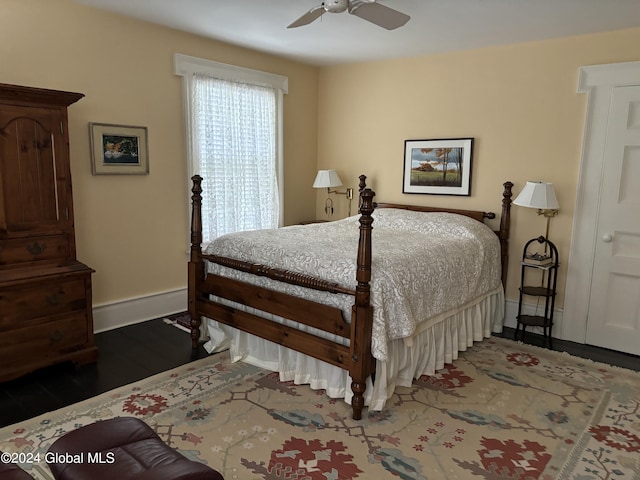 bedroom featuring dark hardwood / wood-style flooring and ceiling fan