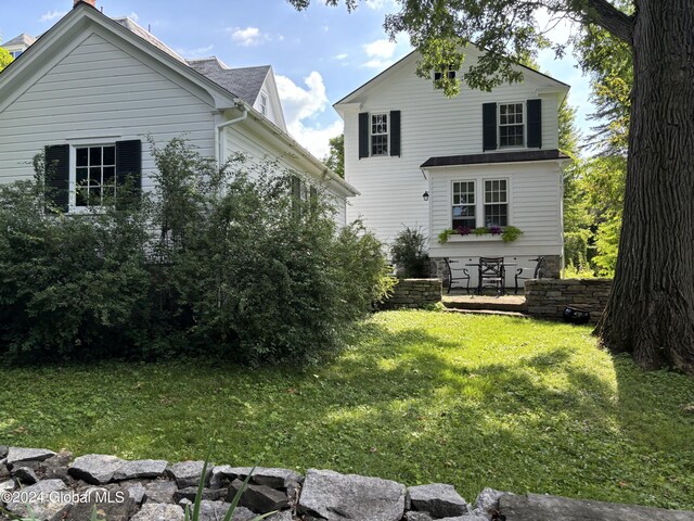 113 S William St, Johnstown, NY 12095 - rear view of house with a yard