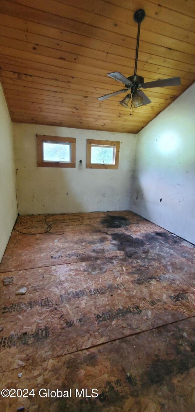 spare room featuring ceiling fan, vaulted ceiling, and wood ceiling