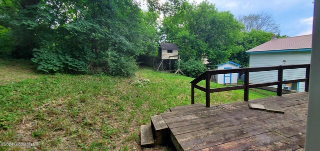 view of yard with a wooden deck